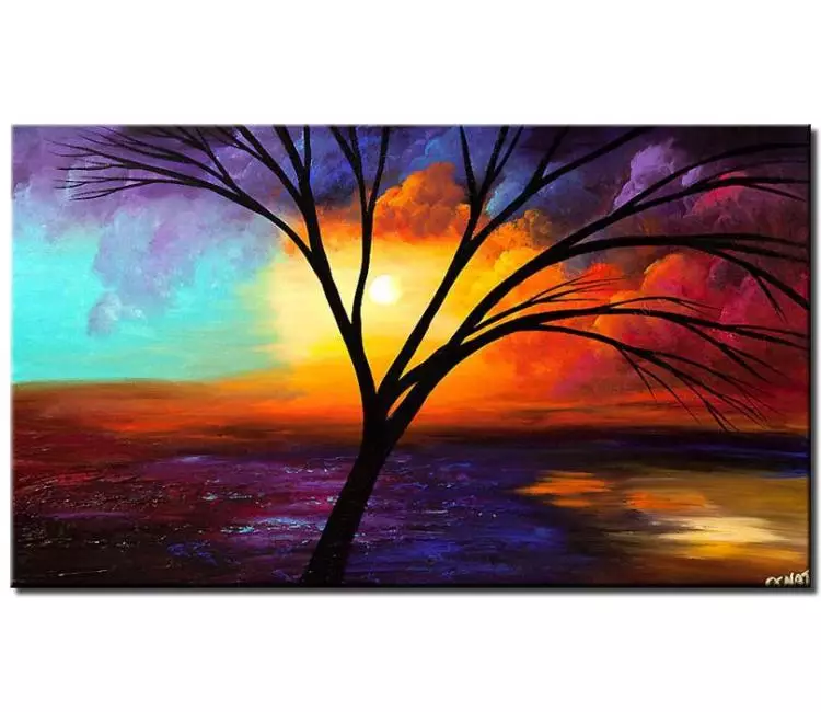 print on canvas - canvas print of leafless tree over colorful sunrise