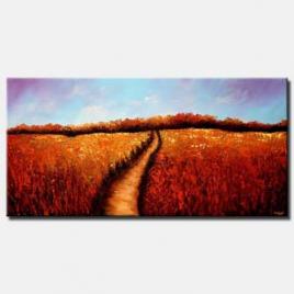 red field of flowers with trail in the middle