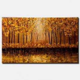 canvas print of golden forest over river bank